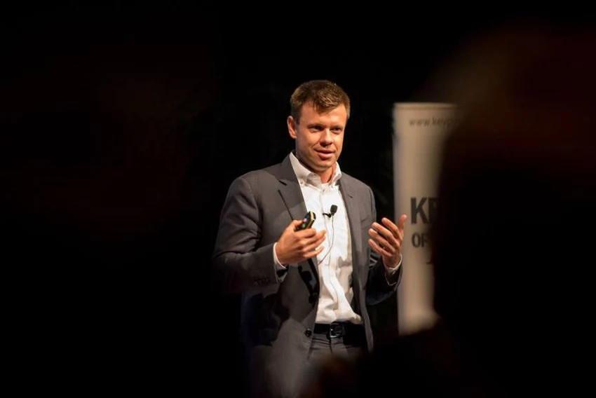Matthew speaking on stage